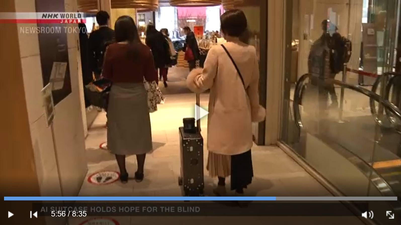 Цитата из видео «Ai Suitcase Holds Hope For The Blind» канала NHK