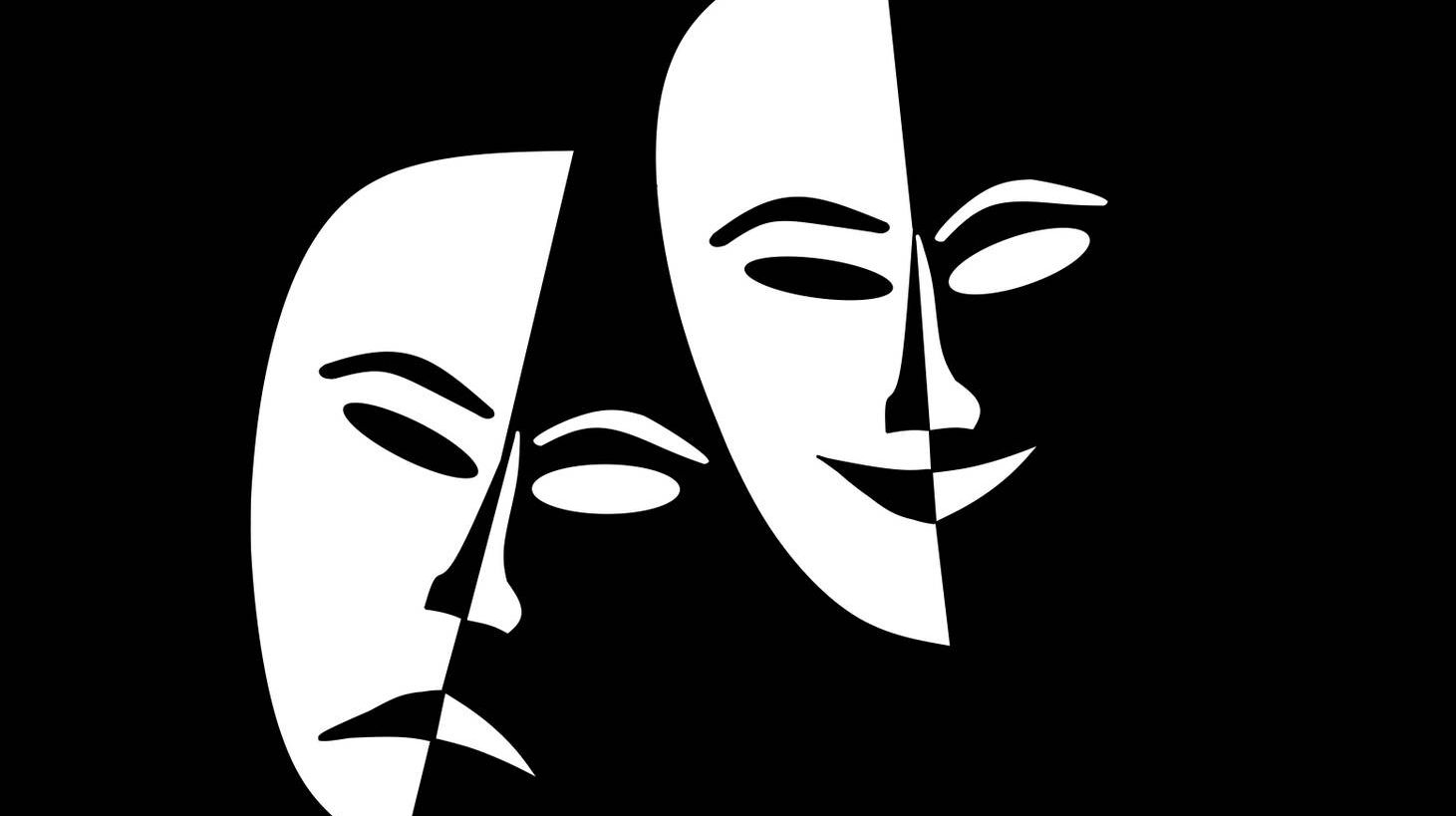 Театральные маски на черном фоне
