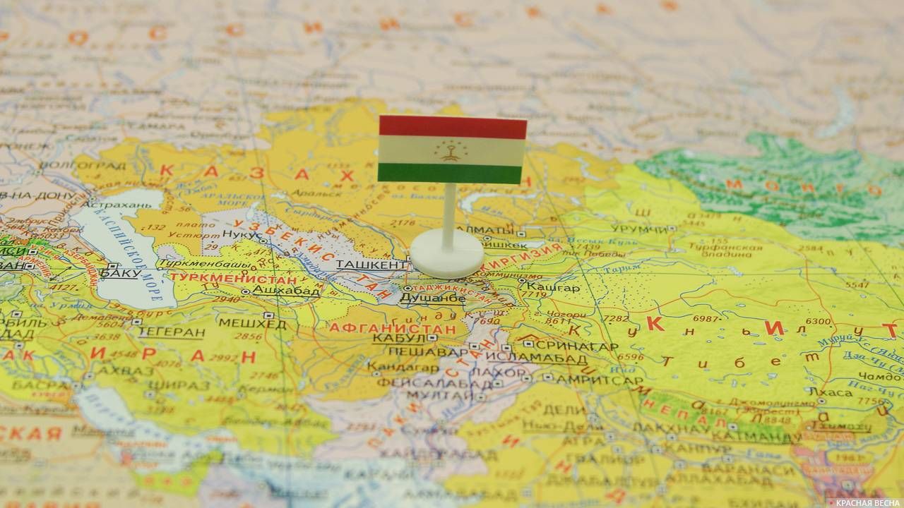 Таджикистан с флагом на карте мира