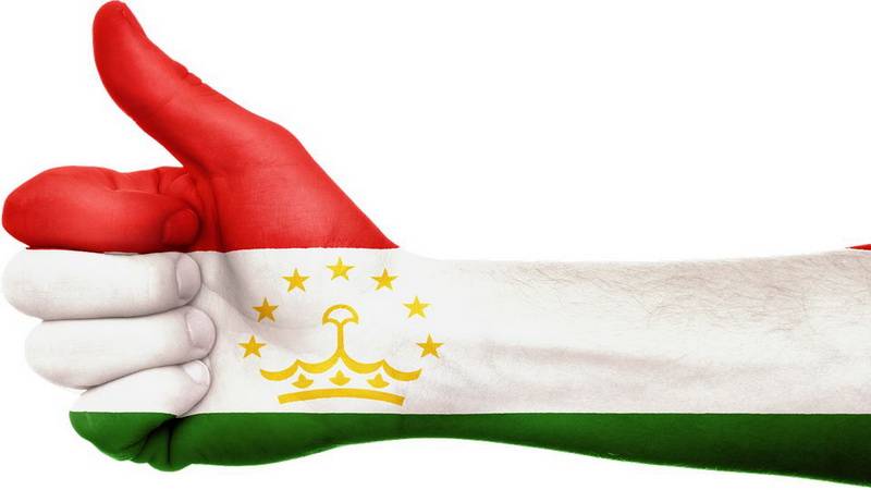 Рука с флагом Таджикистана
